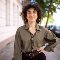 confident non-binary person standing with hand on hip outdoors - fashion stock pictures, royalty-free photos & images