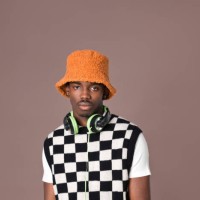 confident young man against brown background - fashion stock pictures, royalty-free photos & images