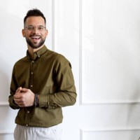 confident young man in casual green shirt looking away - fashion stock pictures, royalty-free photos & images