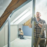 construction worker measuring metal for drywall at site - home decoration stock pictures, royalty-free photos & images