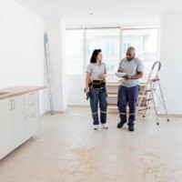 construction workers analyzing blueprints in the apartment - home decoration stock pictures, royalty-free photos & images
