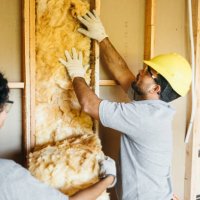 construction workers fitting insulation - home decoration stock pictures, royalty-free photos & images
