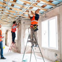 construction workers installing ceiling and windows in renovation - home decoration stock pictures, royalty-free photos & images