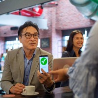 contactless payment in a coffee shop - junk food stock pictures, royalty-free photos & images