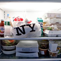 Containers of take-out food fill refrigerator shelves inside the apartment of Marc Dreier, founder of the law firm Dreier LLP sentenced to 20 years...