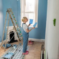 contemplating her paint options - home decoration stock pictures, royalty-free photos & images