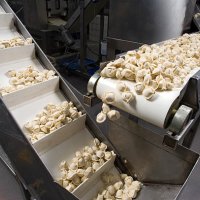 conveyor belt dispensing tortellini - food stock pictures, royalty-free photos & images