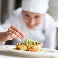 cook decorating a plate - food stock pictures, royalty-free photos & images