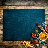 cooking background: multi colored spices, herbs and vegetables on rustic wooden table. copy space - food stock pictures, royalty-free photos & images
