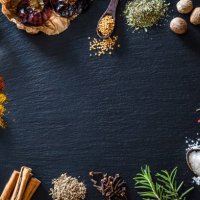cooking nd seasoning spices border on black slate background - food stock pictures, royalty-free photos & images