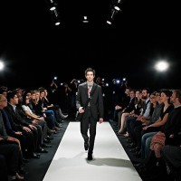 cool geek walking down runway at fashion show - fashion stock pictures, royalty-free photos & images
