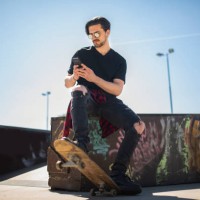cool guy with sunglasses and smart phone, relaxing at city skate park stock photo - fashion stock pictures, royalty-free photos & images