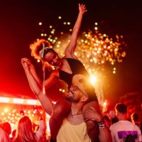couple celebrating with fireworks - concert stock pictures, royalty-free photos & images