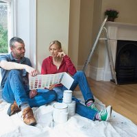 couple choosing paint colors in new home - home decoration stock pictures, royalty-free photos & images