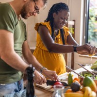 couple cooking together at home - food stock pictures, royalty-free photos & images