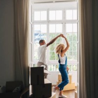 couple dancing in new house seen through doorway - home decoration stock pictures, royalty-free photos & images