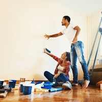 couple decoration their apartment. - home decoration stockfoto's en -beelden