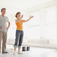 couple discussing freshly painted room - home decoration stock pictures, royalty-free photos & images