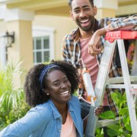 couple doing home repairs outside house - home decoration stock pictures, royalty-free photos & images