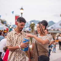 couple eating popcorn in tourist town - food stock pictures, royalty-free photos & images