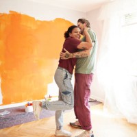 couple embracing at home during renovation - home decoration stock pictures, royalty-free photos & images