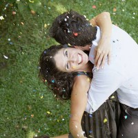 couple embracing outdoors with white wine and confetti smiling - garden decoration stock pictures, royalty-free photos & images