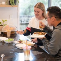 couple enjoying takeaway delivered food at home - junk food stock pictures, royalty-free photos & images