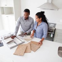 couple examining fabric swatches in new home - home decoration stock pictures, royalty-free photos & images