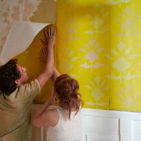 couple hanging wallpaper - home decoration stock pictures, royalty-free photos & images