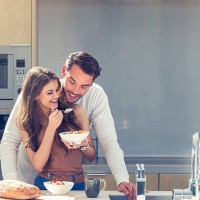 couple having fun eating breakfast. - food stock pictures, royalty-free photos & images