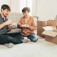 couple having lunch at home during quarantine - junk food stock pictures, royalty-free photos & images