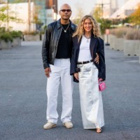 Couple Mads Emil & Emili Sindlev wears silver white skirt, black blazer, pink bag, white shirt wears outside COS on September 12, 2023 in New York...