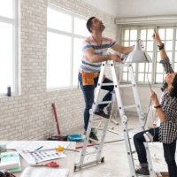couple making renovations, changing lighting equipment - home decoration stock pictures, royalty-free photos & images
