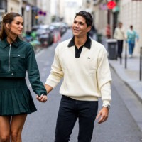 Couple Maria Pombo wears green jacket, pleated skirt & Pablo Castellano wears beige sweater outside Lacoste during Womenswear Spring/Summer 2025 as...
