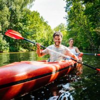 couple paddling together in kayak - travel stock pictures, royalty-free photos & images
