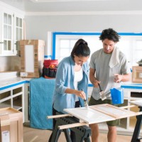 couple painting and fixing up their home - home decoration stock pictures, royalty-free photos & images