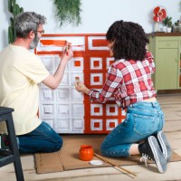 couple painting furniture with brush at home - home decoration stock pictures, royalty-free photos & images