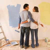 couple painting room, rear view - home decoration stock pictures, royalty-free photos & images