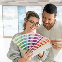 couple painting their house - home decoration stock pictures, royalty-free photos & images