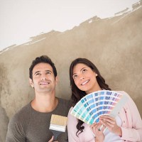 couple painting their house together - home decoration stock pictures, royalty-free photos & images