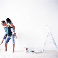 couple playing while painting room - home decoration stock pictures, royalty-free photos & images