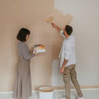 couple renovating and choosing paint colors for their home - home decoration stock pictures, royalty-free photos & images