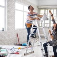 couple renovating their apartment - home decoration stock pictures, royalty-free photos & images