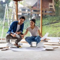 couple sharing some decoration ideas while renovating their house - home decoration stock pictures, royalty-free photos & images