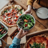 couple sharing takeaway meal at home - food stock pictures, royalty-free photos & images