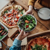 couple sharing takeaway meal at home - junk food stock pictures, royalty-free photos & images