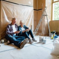 couple sitting relaxing - home decoration stock pictures, royalty-free photos & images