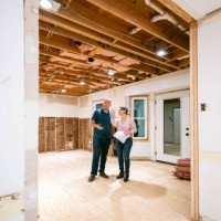 couple supervising home renovation progress - home decoration stock pictures, royalty-free photos & images