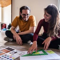 couple talking while making decisions about the new apartment - home decoration stock pictures, royalty-free photos & images