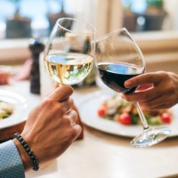 couple toasting with wine, close-up - food photos et images de collection